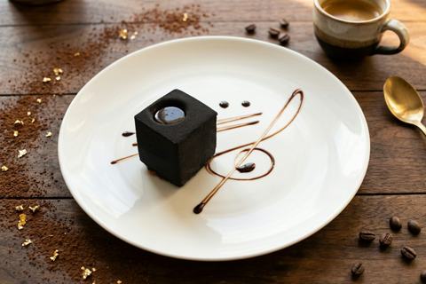 Illustrative dark chocolate torte; presentation may differ